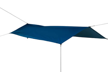 Sea to Summit poncho royal blue used as shelter with guy attachment points.