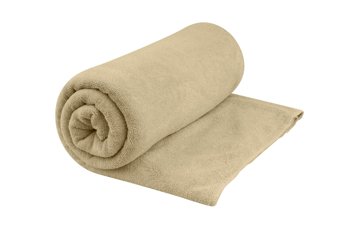 Sea to Summit Tek Towel plush fabric close-up showing soft terrycloth handfeel for comfort.