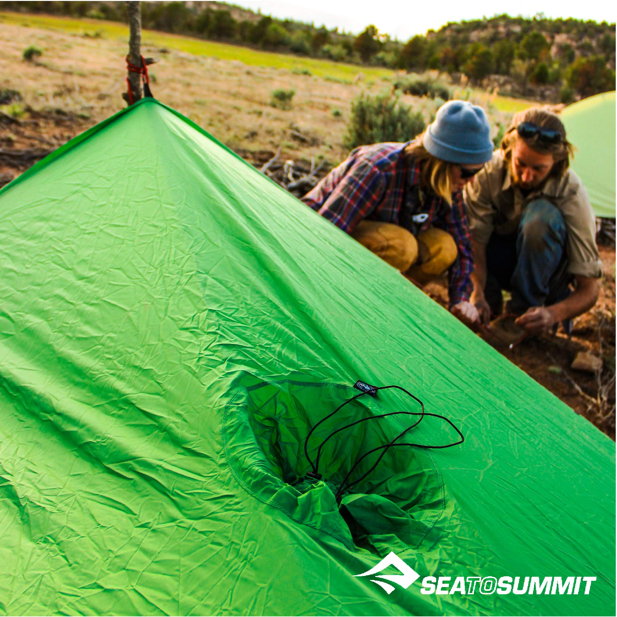Sea to Summit Ultra-SIL Nano Tarp Poncho serving as a groundsheet on damp ground