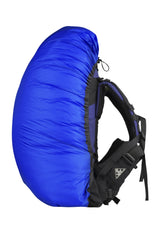 Sea to Summit Ultra-SIL waterproof backpack cover in royal blue shields medium packs from rain while hiking.