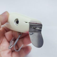 Close-up of SEASKY wood lure showing stainless steel diving lip and glow coating