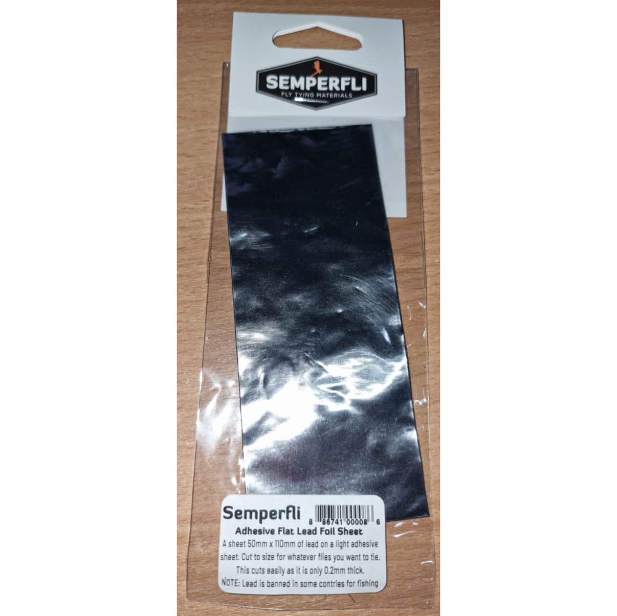 Semperfli lead foil sheet cut-to-size demonstrates easy shaping for weighted flies.