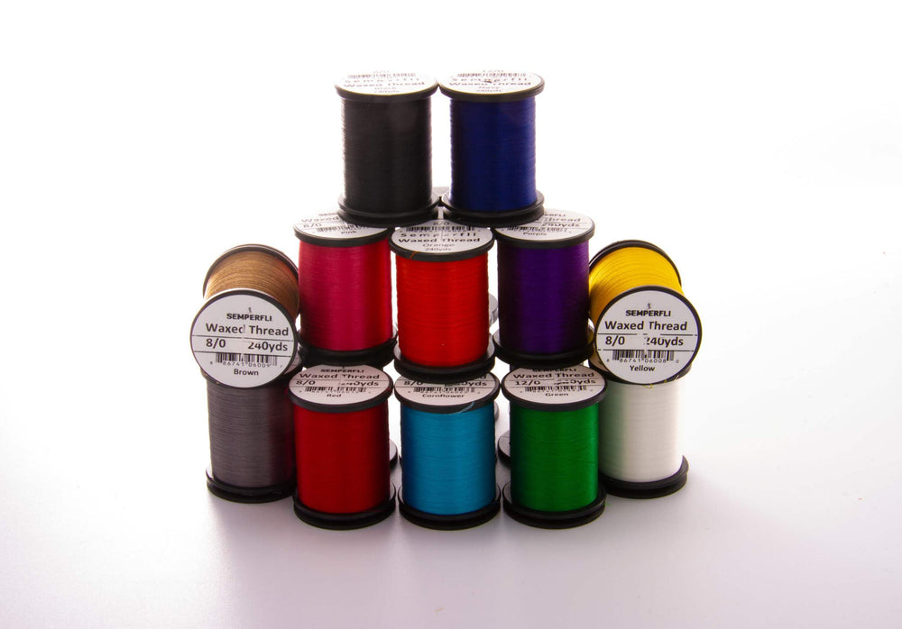 Semperfli Classic Waxed Thread in purple used on a fly-tying project for durability.