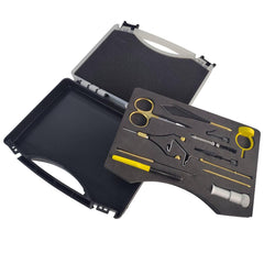 Stainless steel tools including hackle pliers and scissors in storage case