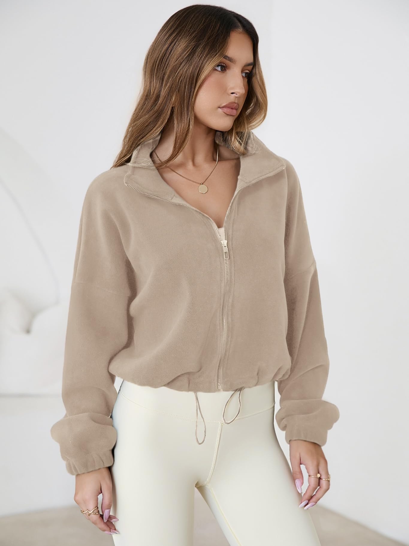 SHELOOKS fashion-forward zip-up jacket adds modern style to autumn and winter outfits.