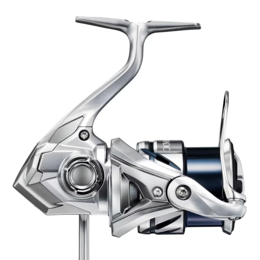 Shimano Stradic C3000XG reel winding action close-up highlights powerful, steady winding
