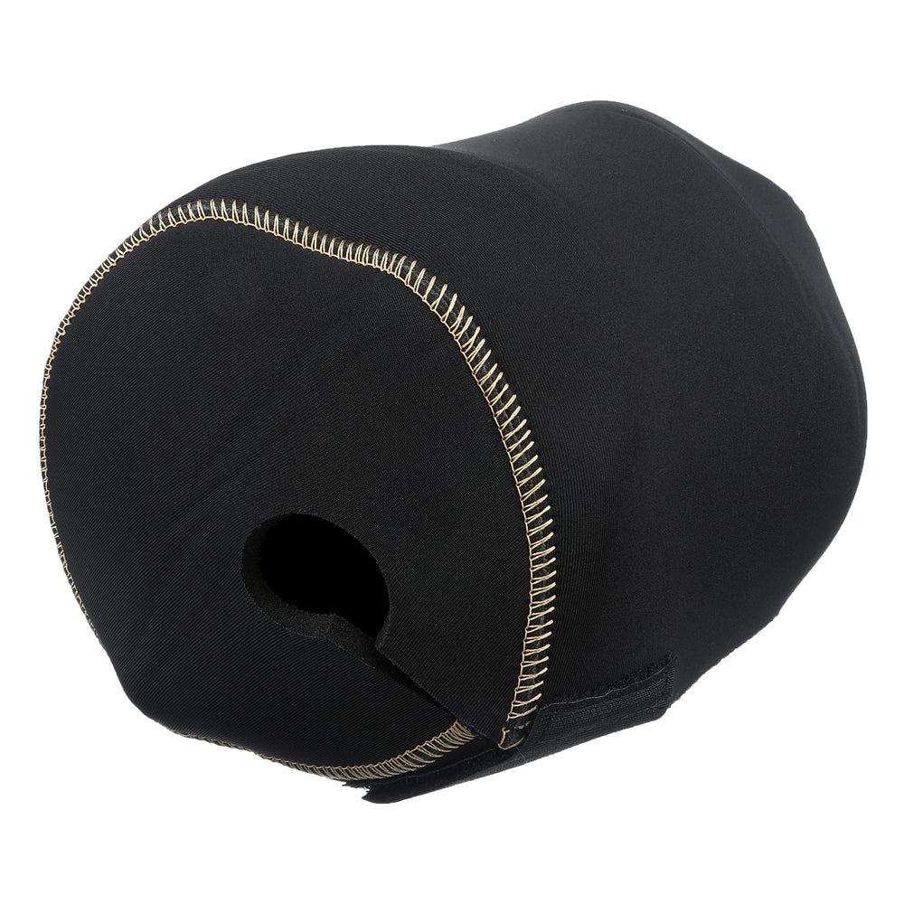 Detail of the gold Tiagra logo on shiny black fabric.