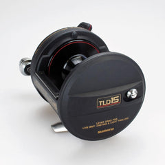 Shimano TLD15 graphite titanium body close up emphasizes lightweight corrosion resistance.