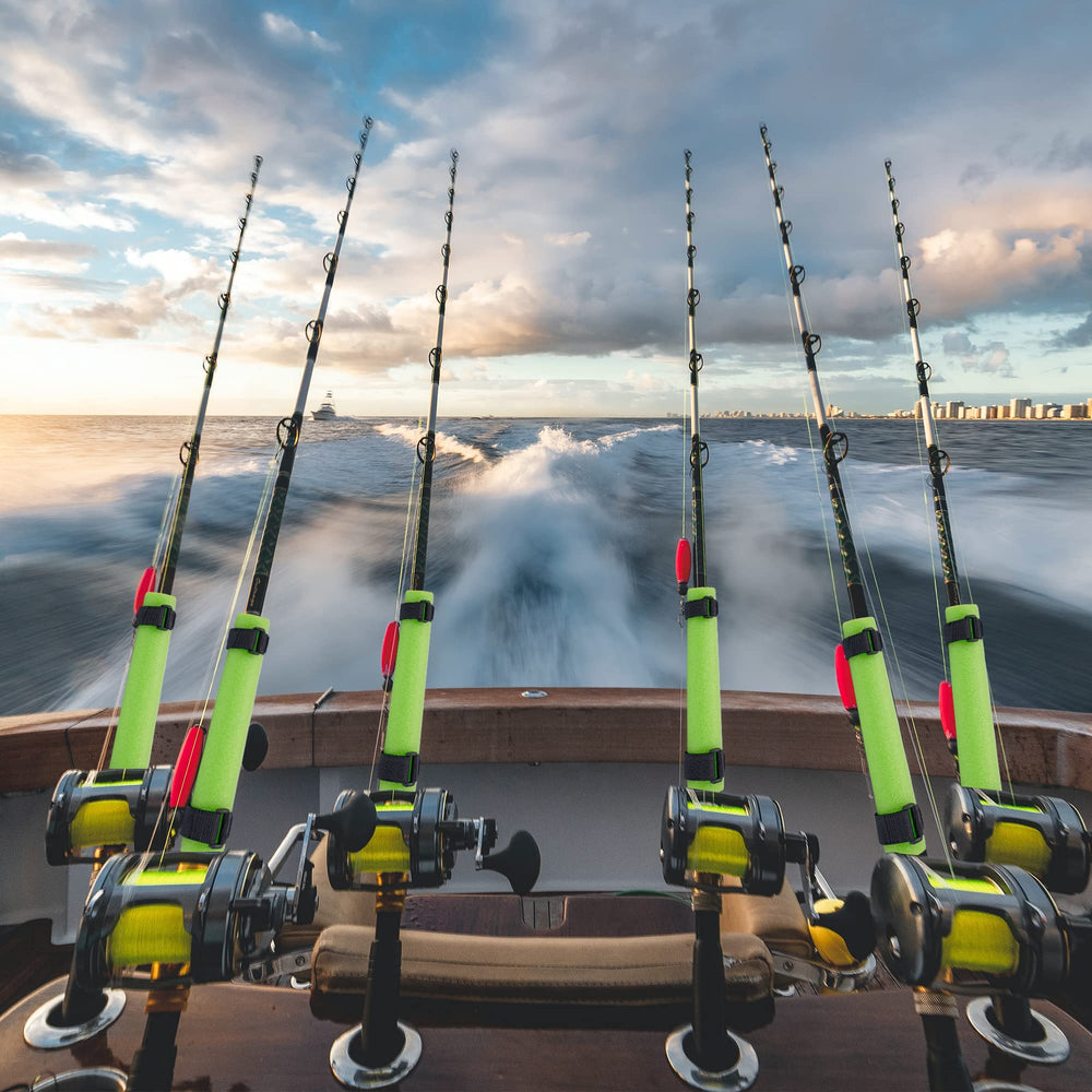 Kayak fishing setup using green rod floats to prevent rod from slipping