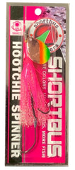 Close-up of the dual deep-shank hooks on the Shortbus lure with UV flare.