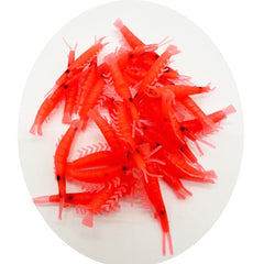 Close-up of red and pink silicone shrimp lures with glow green variation