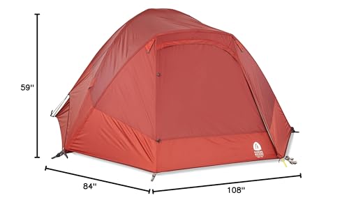 Sierra Designs Alpenglow 4P tent night-time exterior with gentle lighting.
