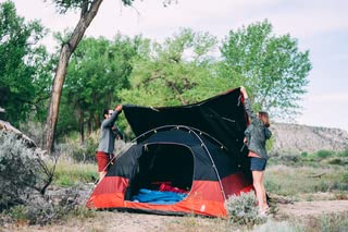 Sierra Designs Alpenglow tent interior reveals large living space and organized gear pockets