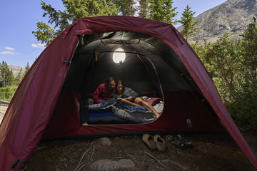 Sierra Designs Alpenglow tent pole setup shows color-coded system for quick pitching