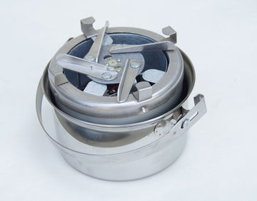 Sierra Stove in use over a campfire with wood fuels.