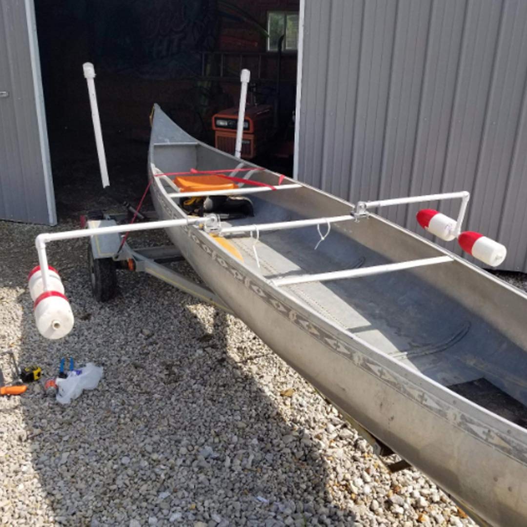 Crab trap floats beside a boat on the lake