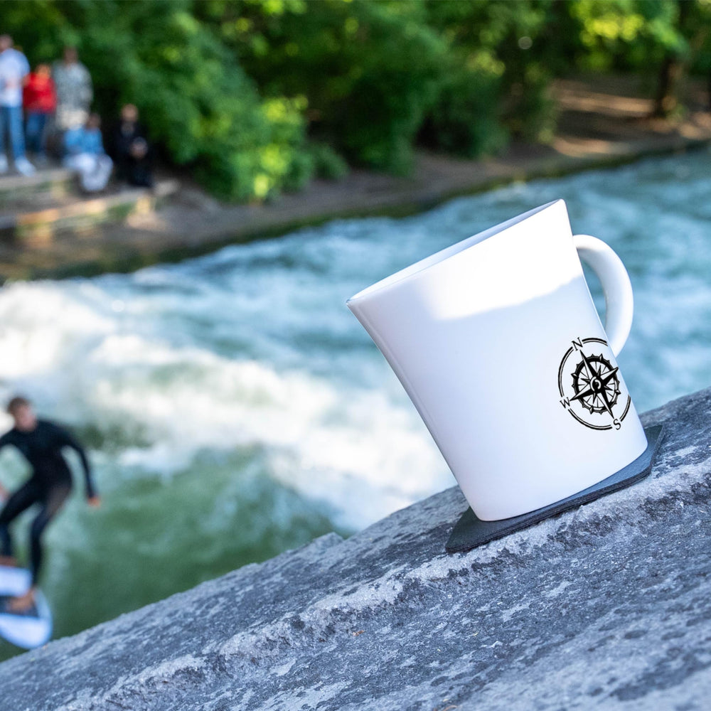 Two porcelain cups with magnetic base stay put during boating and camping trips.