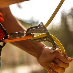 Singing Rock Rama orange side profile highlights slim, travel-friendly belay tool.