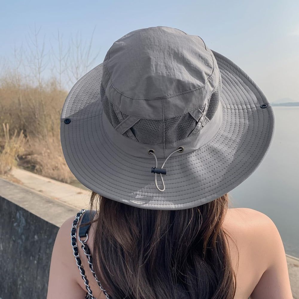 Grey Sireck fishing hat worn outdoors in a sunny setting