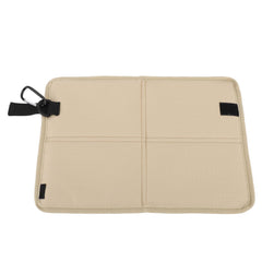 Sit Pad for backpacking showing a dry, foldable seat cushion on damp ground.