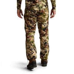 SITKA Dew Point pant side zip shows easy on/off and venting in bad weather.