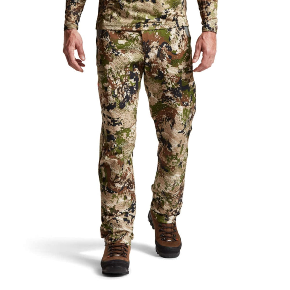 SITKA Traverse pants water-repellent finish sheds light rain for wet vegetation.