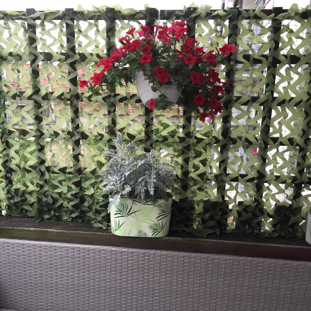 Sitong green camo netting blends with natural backgrounds for sunshade setups.