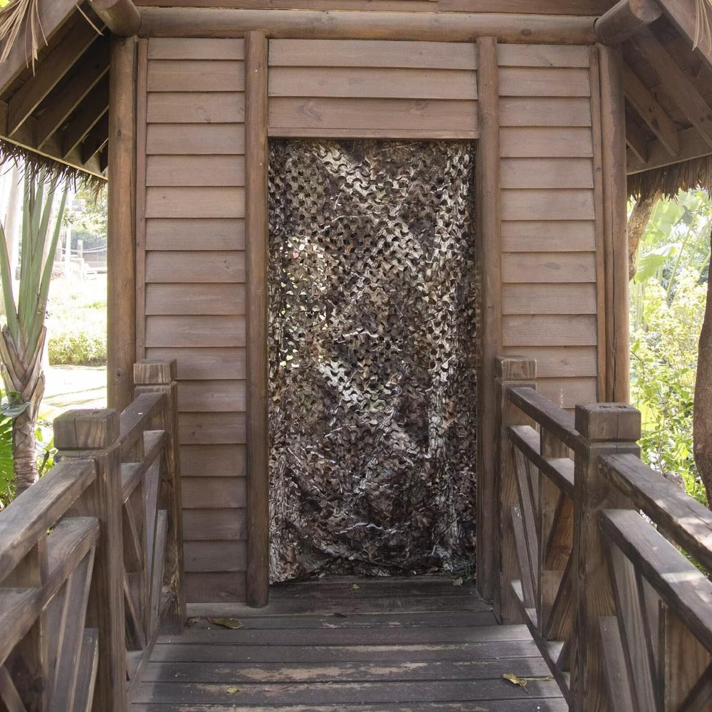 Sitong green camo netting blends with foliage for stealthy hunting and yard decor.