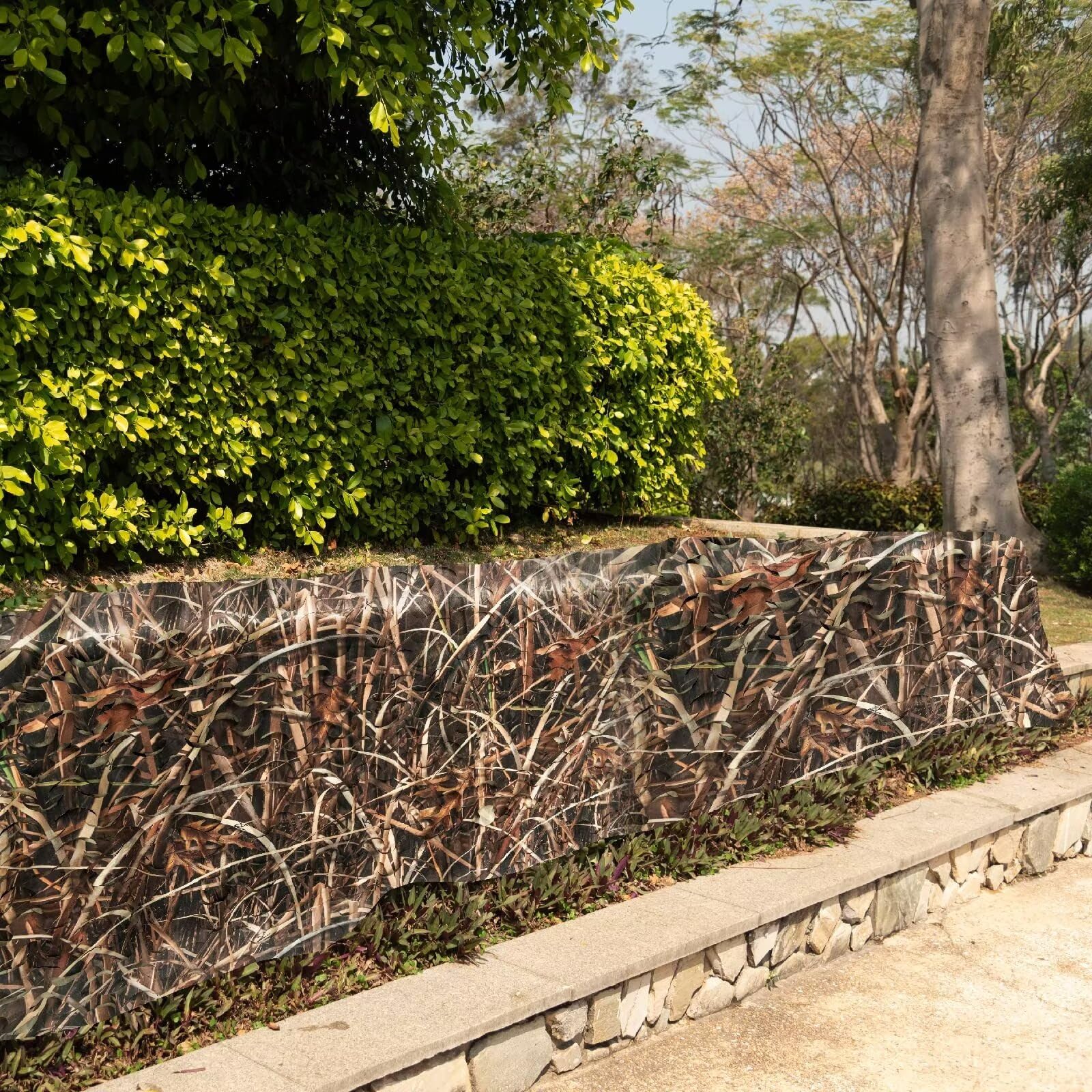 Sitong camo netting sunshade setup used on a tent for shade.