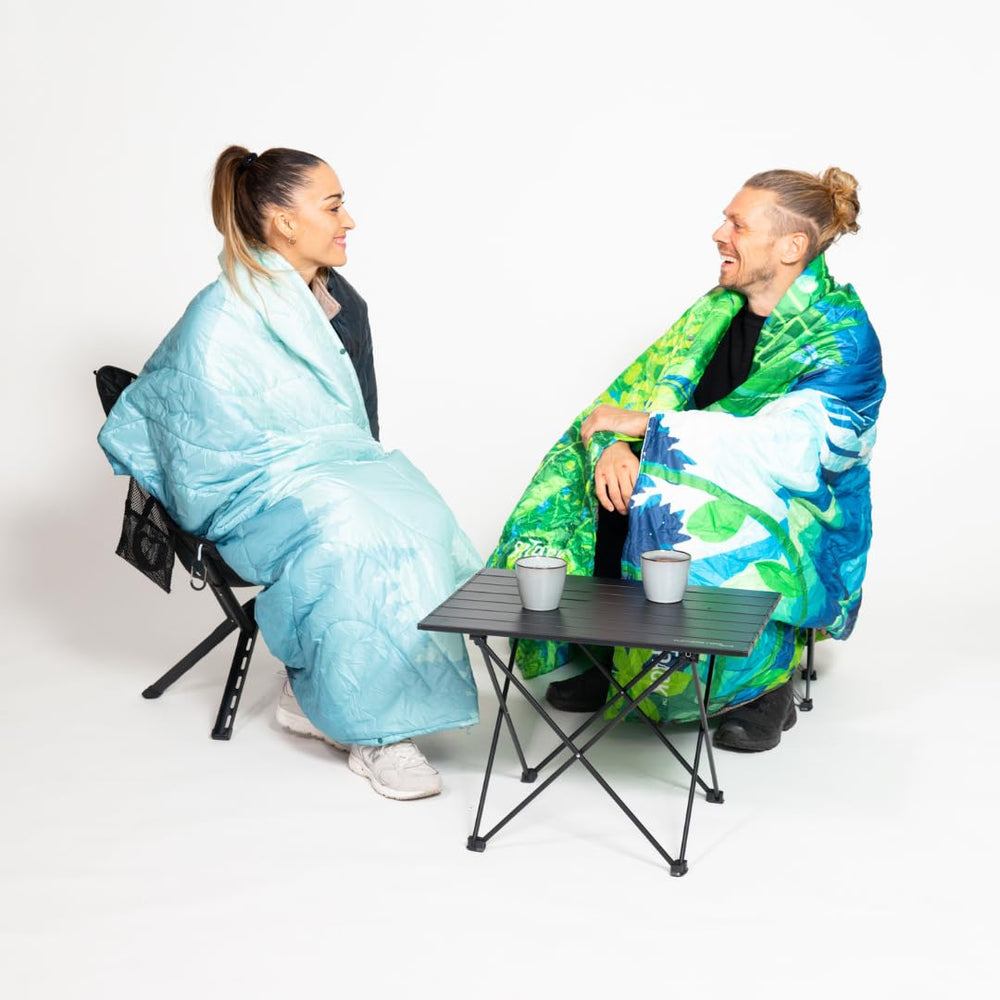 Sitpack Tropic Breeze blanket camping setup serves as versatile outdoor quilt.