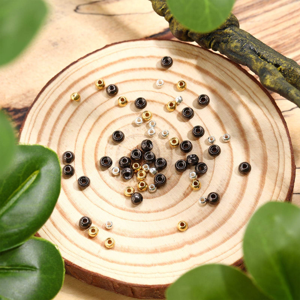 Beads being added to a hook for weight and sinking