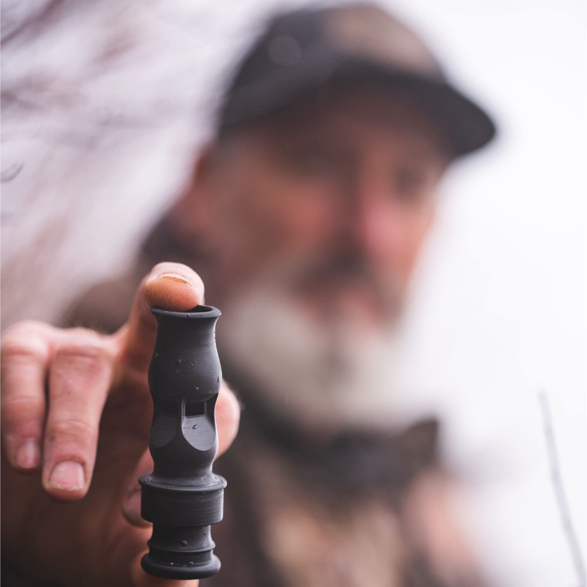 Slayer Calls Call The Wild Whistler’s Mother 4-in-1 duck whistle near weathered lanyard for field use.