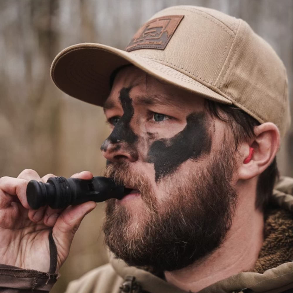Slayer Calls Call The Wild Whistler’s Mother 4-in-1 duck whistle in hand for quick, reliable calling.