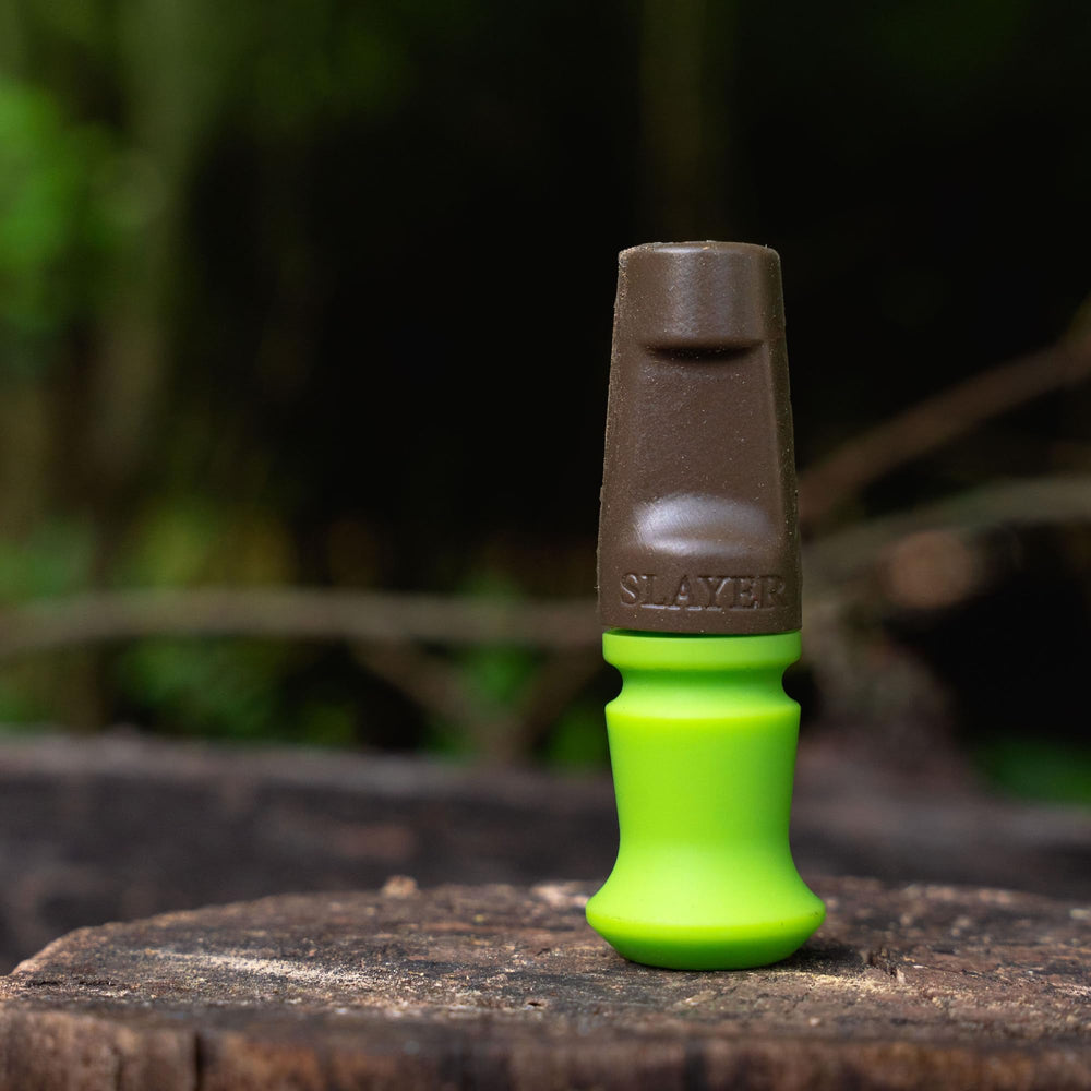 Slayer Calls Harem Elk Call hands-free use illustrates mobility during climb and draw.