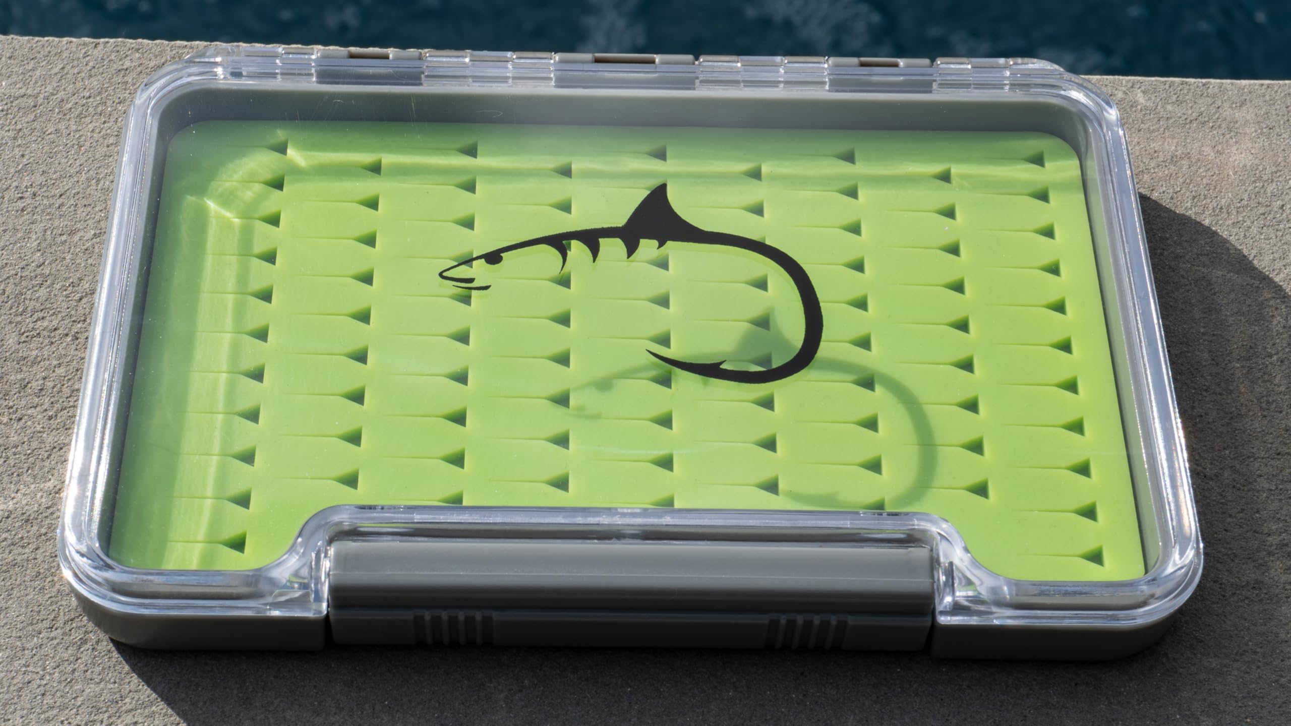 Compact waterproof fly box in pocket with 91 fly capacity