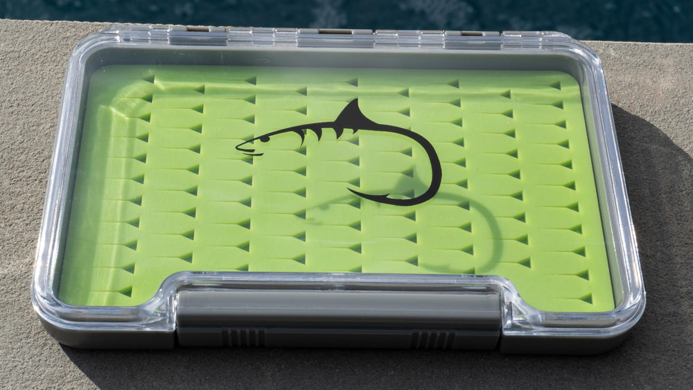 Compact waterproof fly box in pocket with 91 fly capacity