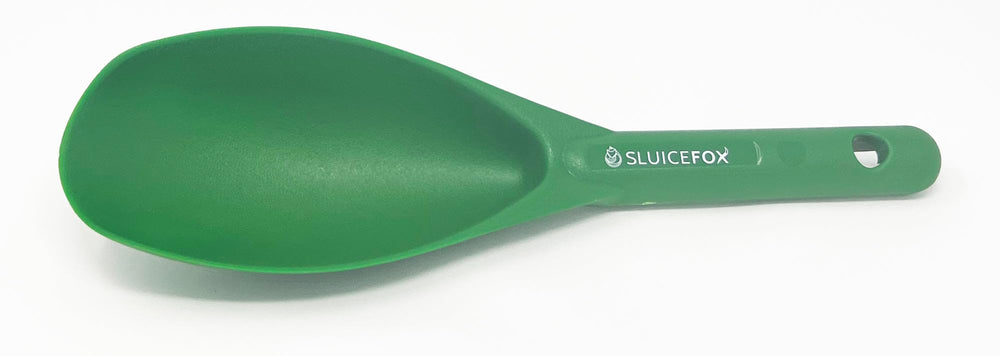 Sluice Fox beveled edge scoop shows quick pay dirt transfers into a pan.