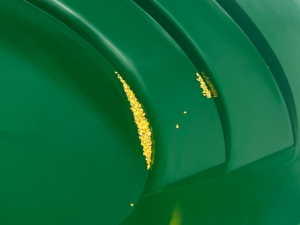Sluice Fox prospector scoop for scooping sediment from streams.