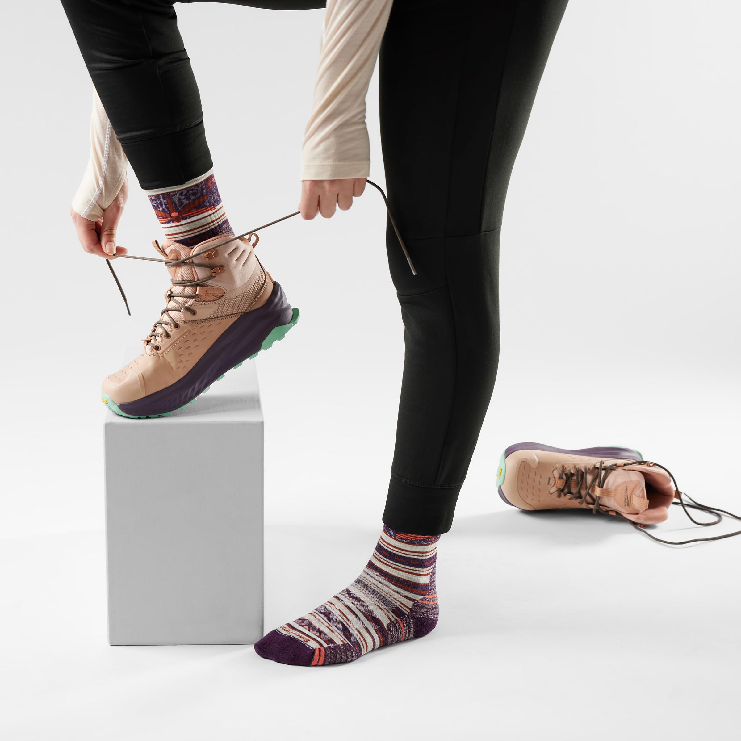 Smartwool Indestructawool durability zones extend life on rugged trails.