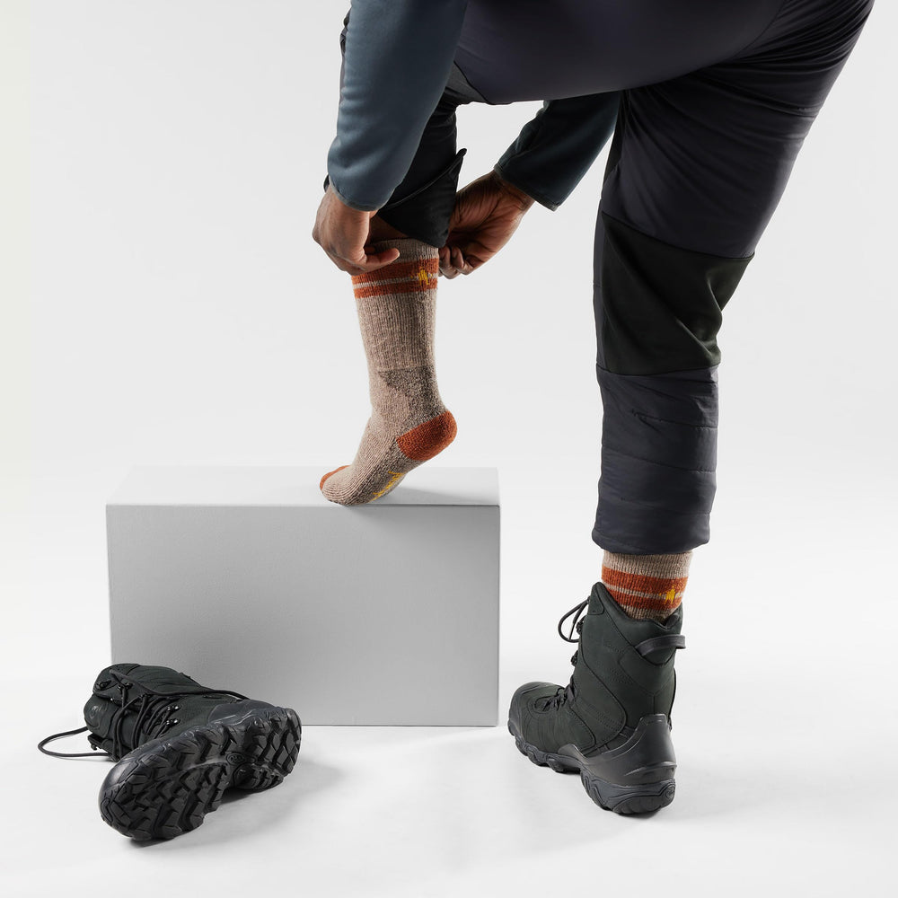 Smartwool Mountaineer socks close-up shows Merino wool texture for moisture management and odor resistance.