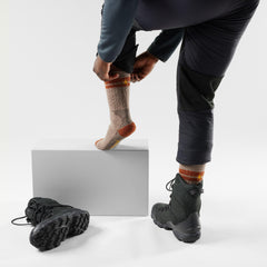 Smartwool Mountaineer socks close-up shows Merino wool texture for moisture management and odor resistance.