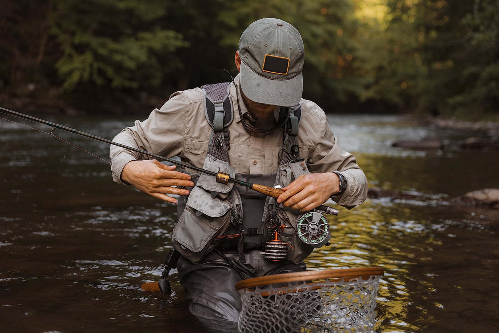 Compact and lightweight Smith Creek clip stays unobtrusive during long fishing days.