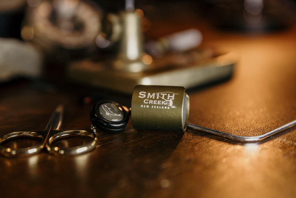 Compact and lightweight Smith Creek Rod Clip in use with green finish