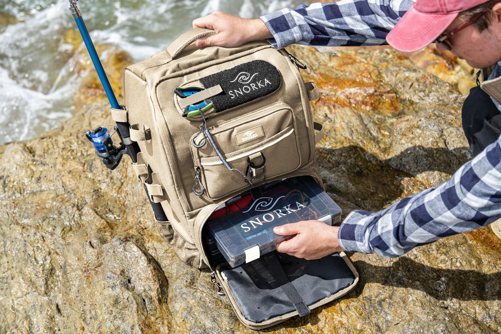 SNORKA fishing backpack with adjustable rod holders for secure hands-free use.