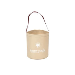 Snow Peak camping bucket used to wash dishes at a campsite.