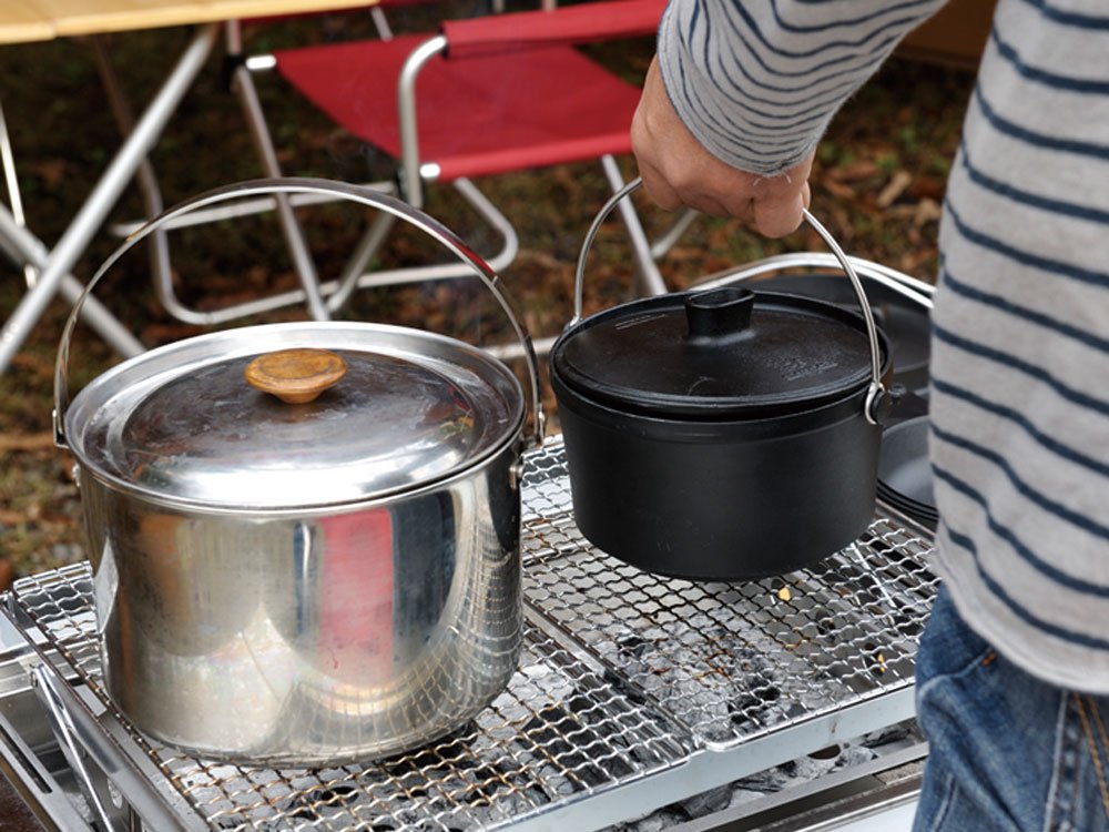 Snow Peak Cast Iron Duo Cooker camping setup showing portability and shared meals