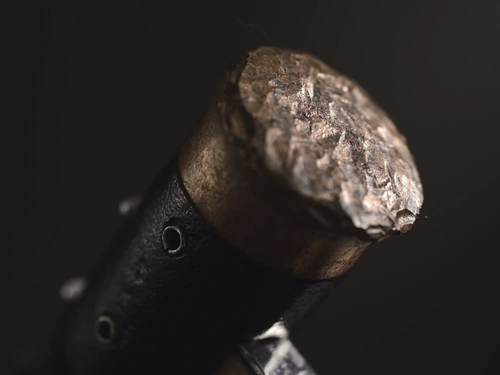 Snow Peak Copper Head Peg Hammer with wood handle reduces vibration during pounding.