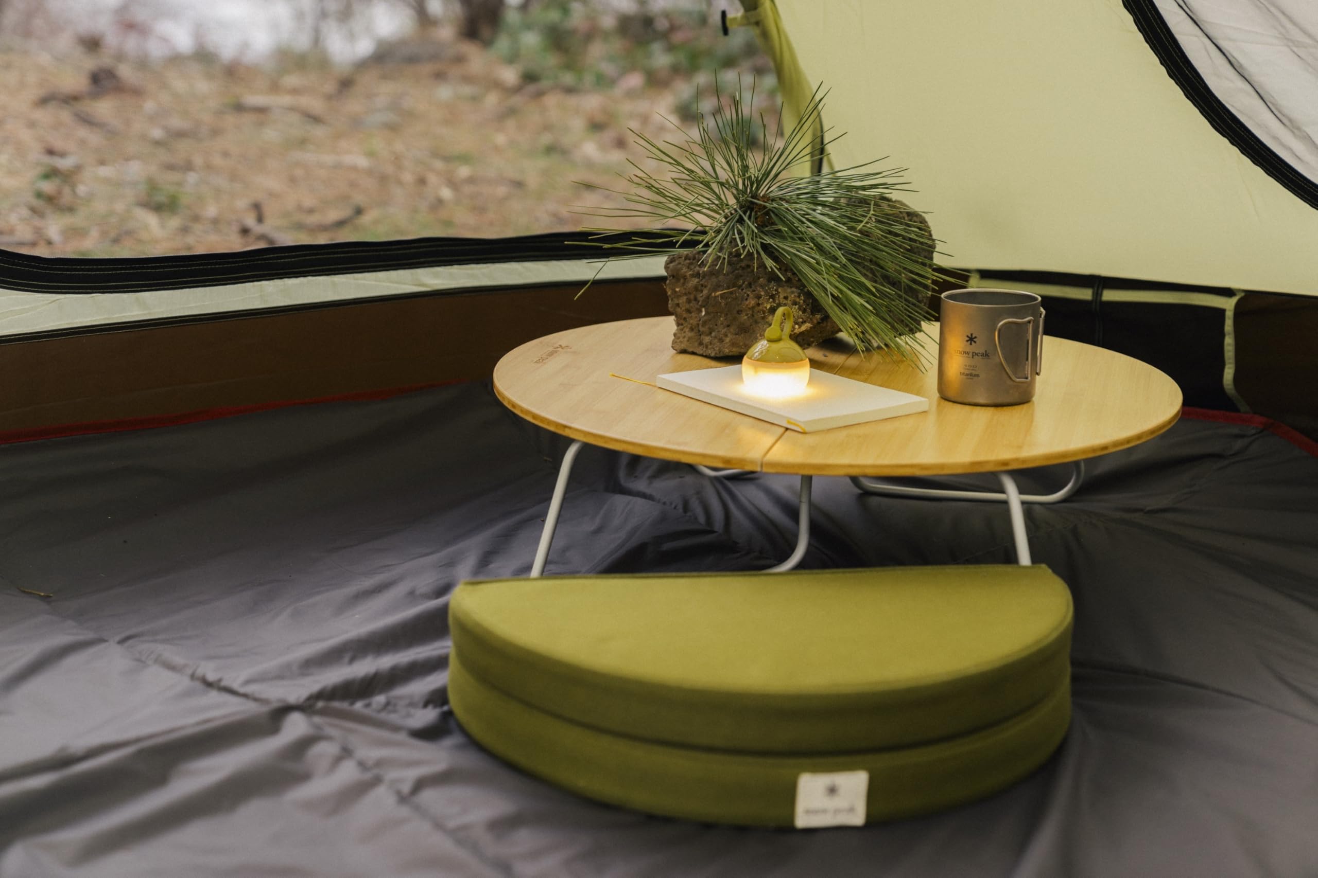 Snow Peak Lounge Cushion serves as a comfortable ground-seat outdoors.