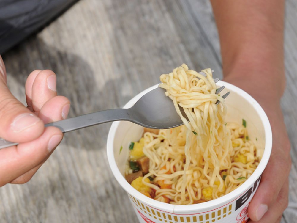 Snow Peak Titanium Foon with rice-scale handle for outdoor rice cooking.