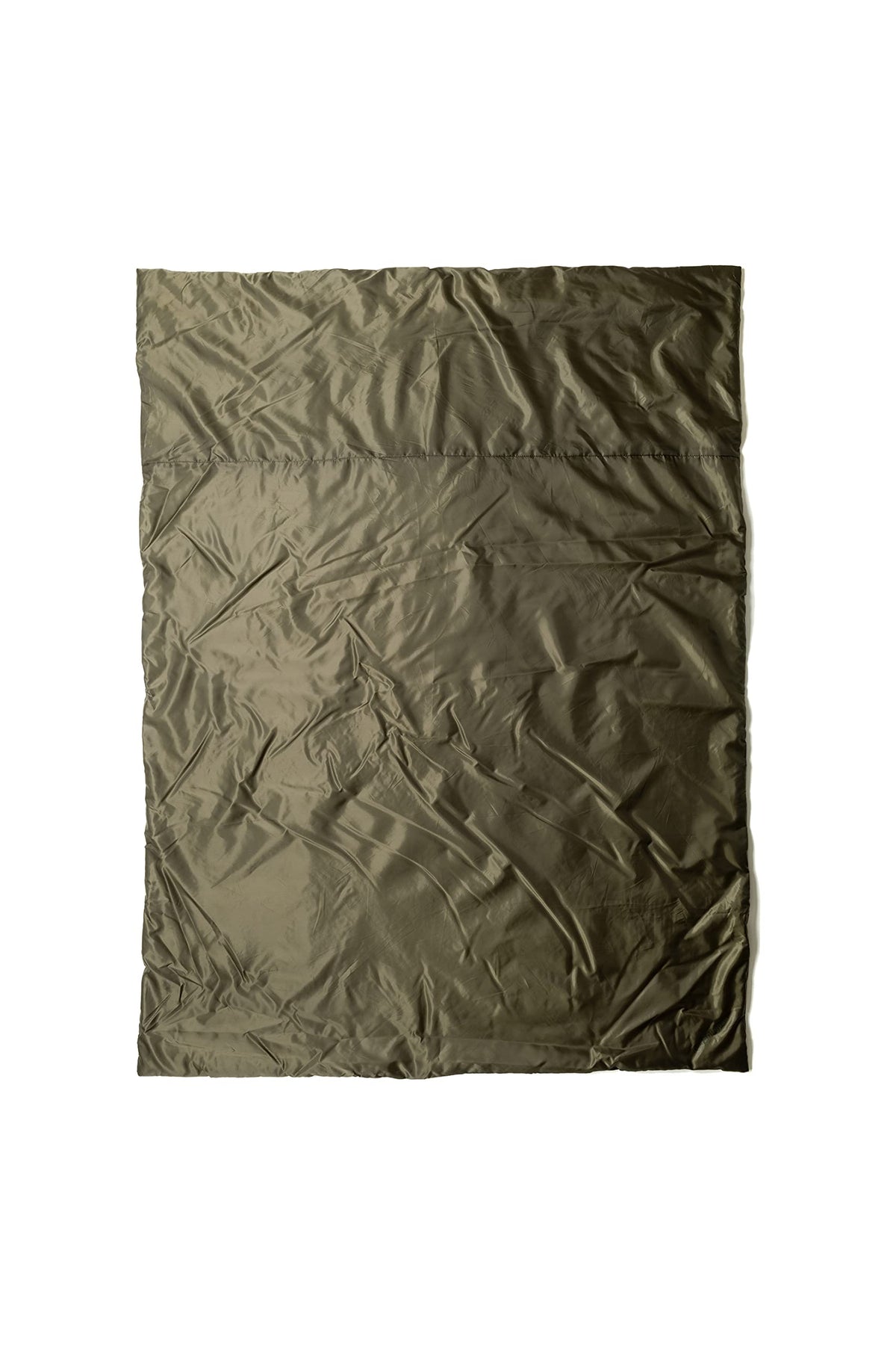 Snugpak Jungle Blanket compressed in its stuff sack, ready for travel.